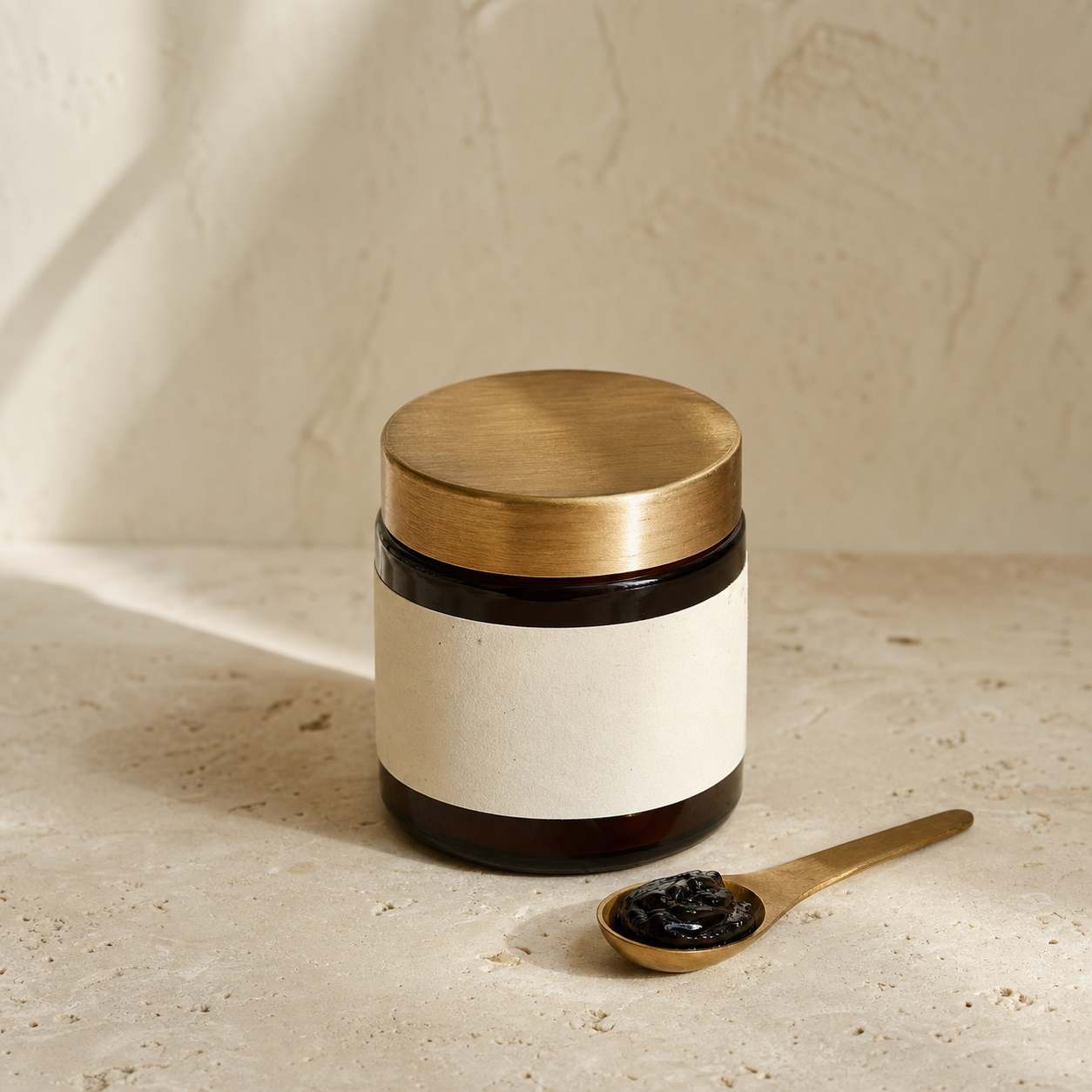 A premium glass jar of Baltistan Organic original shilajit resin with custom serving spoon